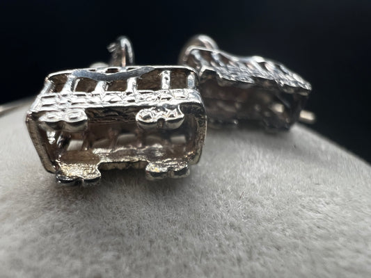 Made from sterling silver, these trolley earrings would be a cute addition to any outfit.