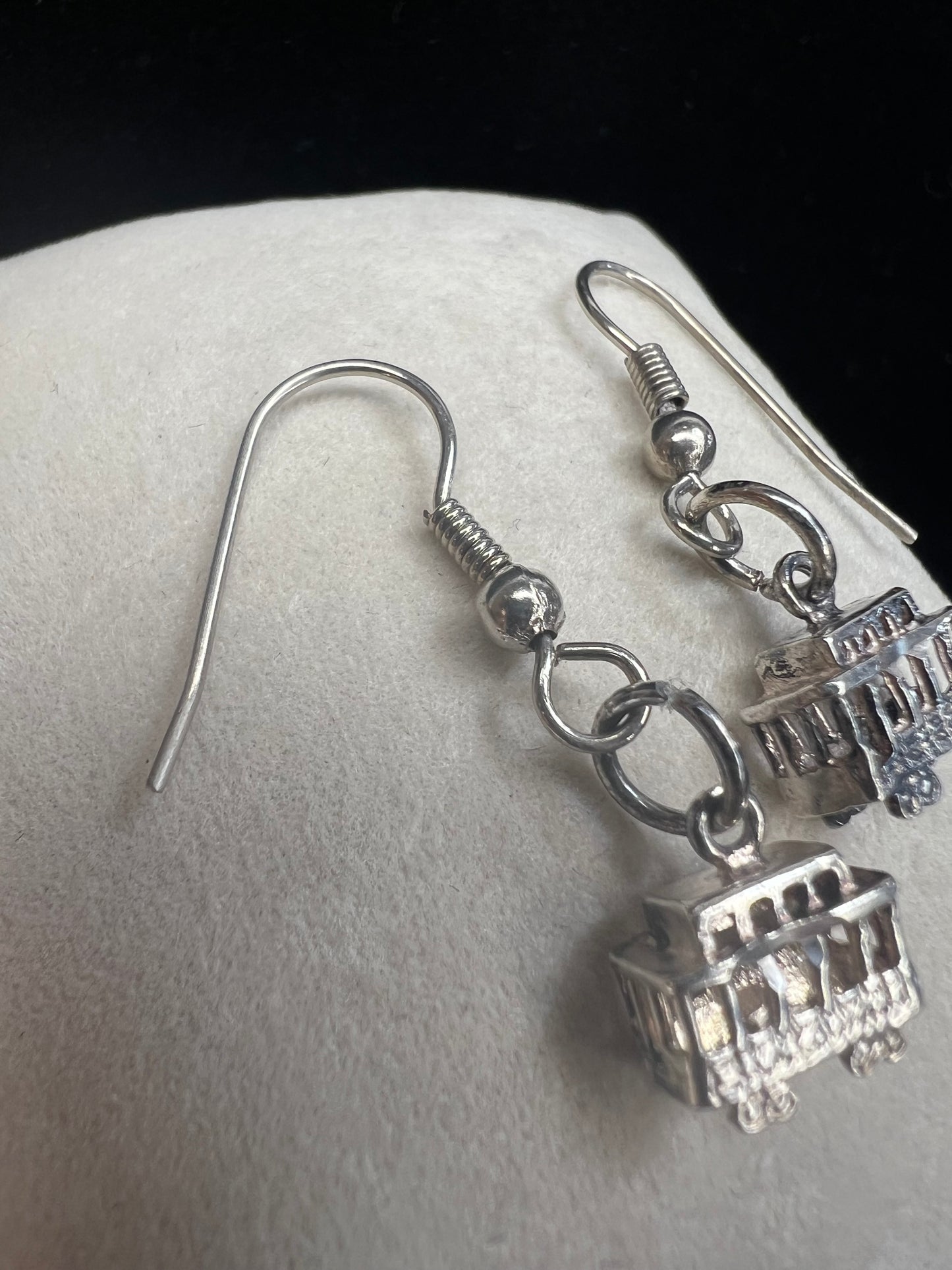 Made from sterling silver, these trolley earrings would be a cute addition to any outfit.