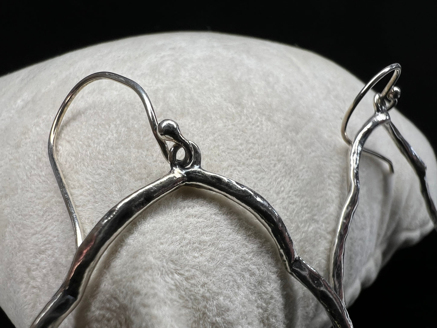 These hammered and scalloped sterling silver earrings will add a bit of flash to your outfit.