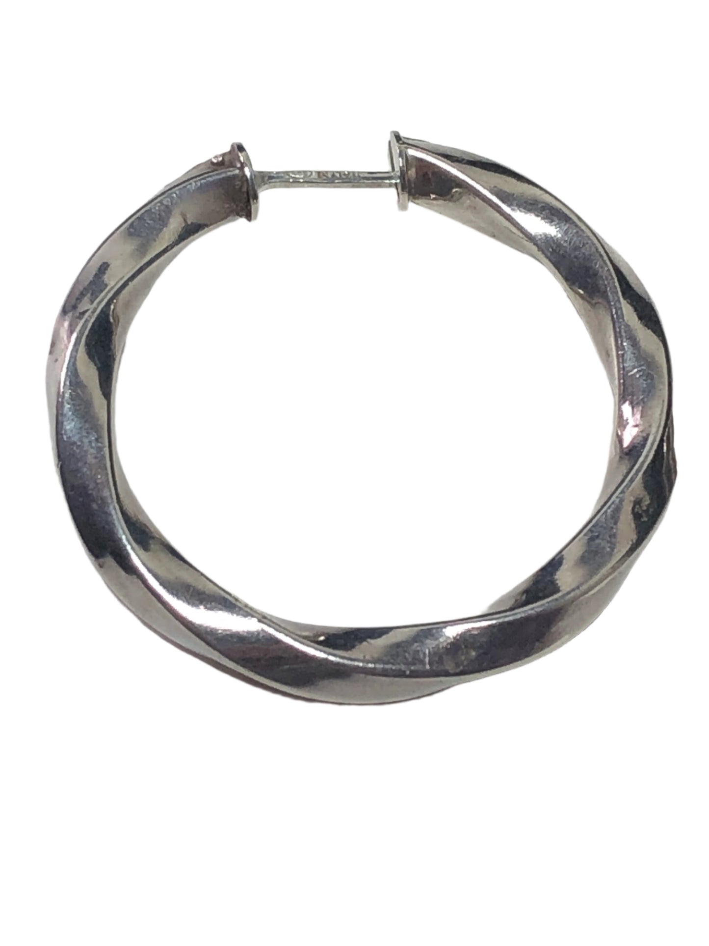 Add a touch of elegance to your outfit with these vintage earrings. They feature a smooth design of gently twisting sterling silver, creating a shifting shine.