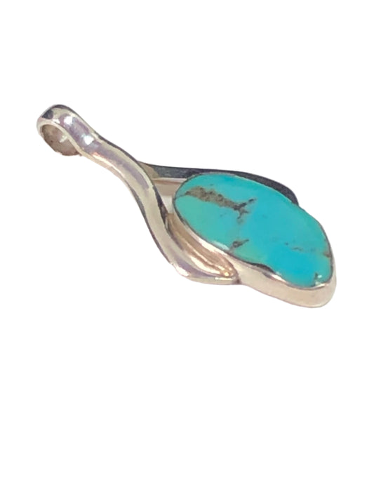 This pendant features a unique faux turquoise stone set in beautifully designed sterling silver.