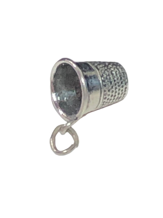 Indulge in this adorable vintage thimble charm made from sterling silver. Perfect for sewing enthusiasts.