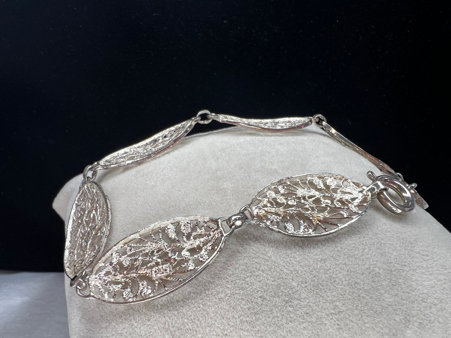 This is a beautiful early vintage filigree bracelet, crafted with intricate detail. Made from .835 silver, this piece will add elegance to your look.