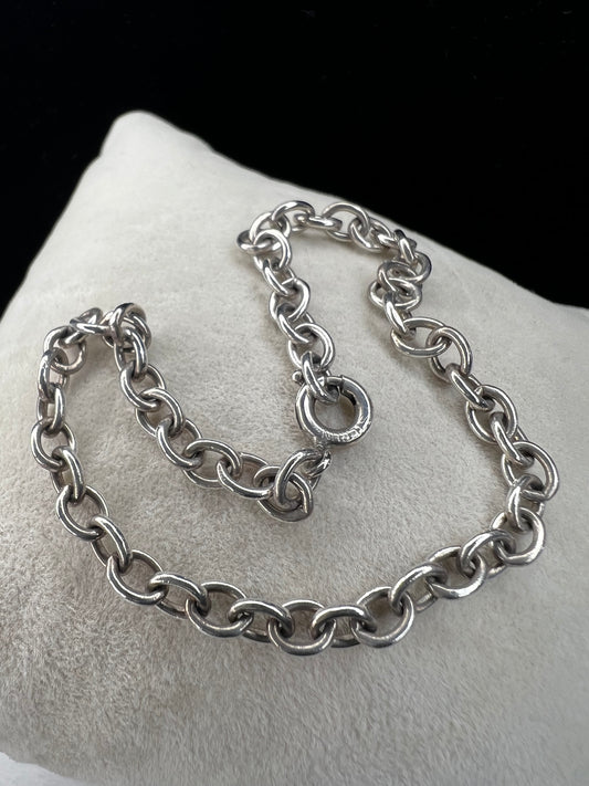 This beautiful sterling silver bracelet can be worn as is, or you can pair it with your choice of charms for a more personalized look.