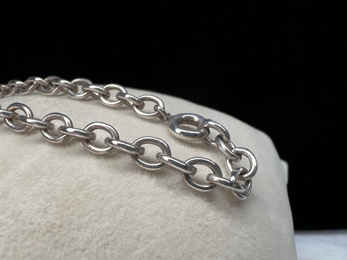 This beautiful sterling silver bracelet can be worn as is, or you can pair it with your choice of charms for a more personalized look.