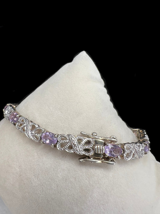 Add a gentle pop of color to your outfit with this elegant bracelet, which features amethysts.