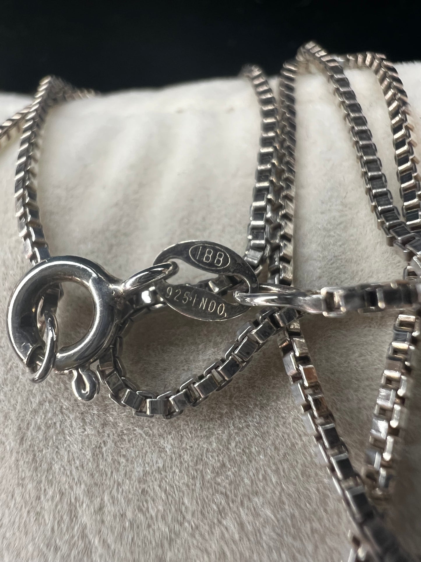 Enhance your style with our sterling silver thin box chain necklace. Perfect for day or night, this petite chain adds a touch of elegance to any outfit.