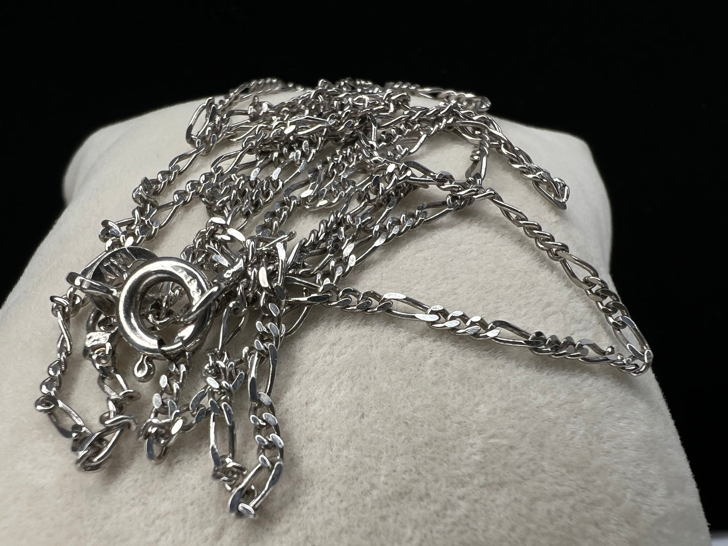 Elevate your style with this petite sterling silver chain. The classic figaro link will add a touch of class to any outfit.