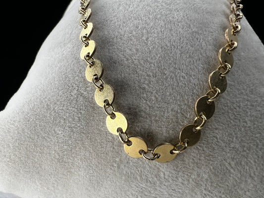 Add some sheen to your outfit with this gold filled necklace. The round flat links will make light dance around your neck.