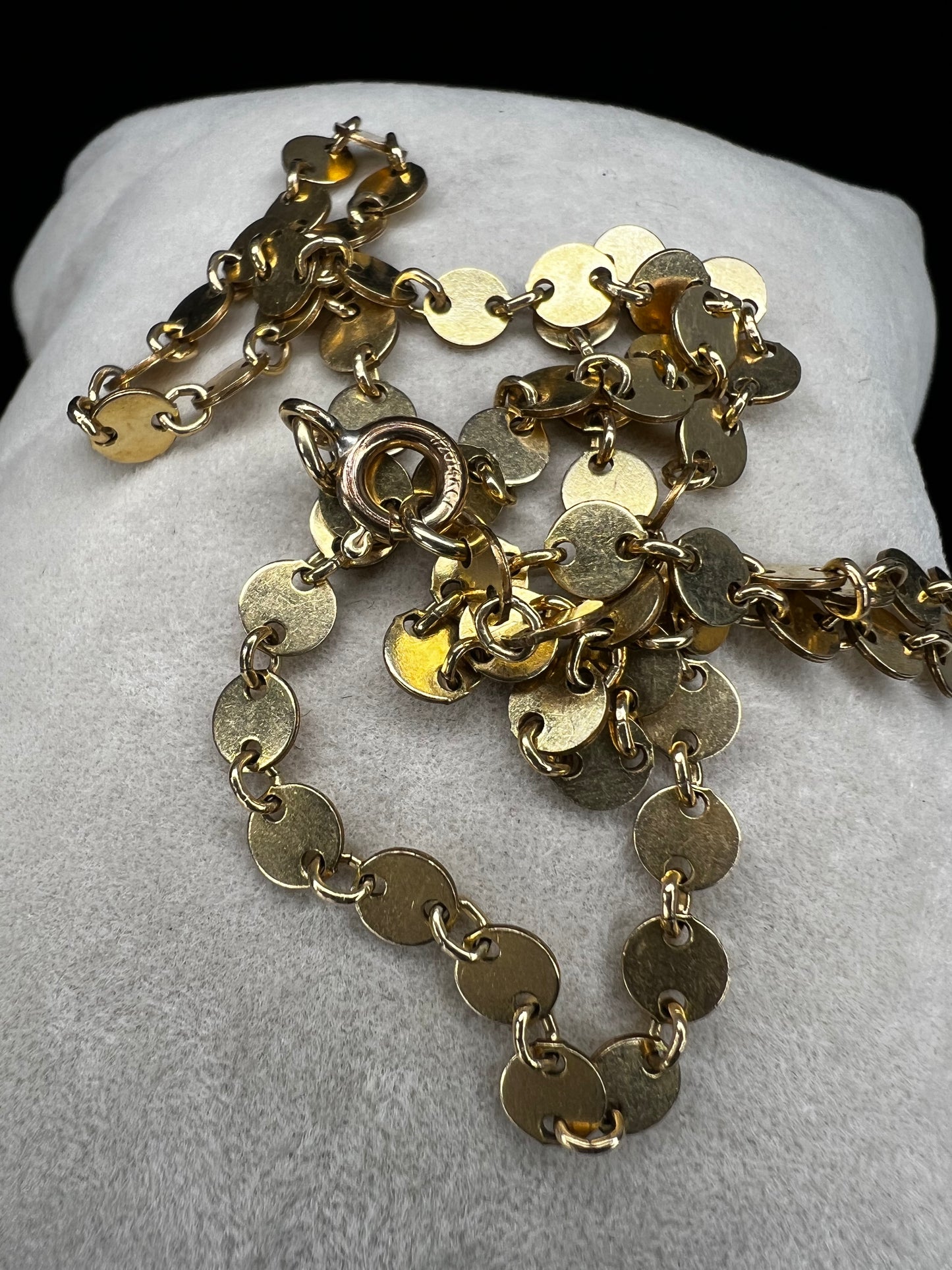 Add some sheen to your outfit with this gold filled necklace. The round flat links will make light dance around your neck.