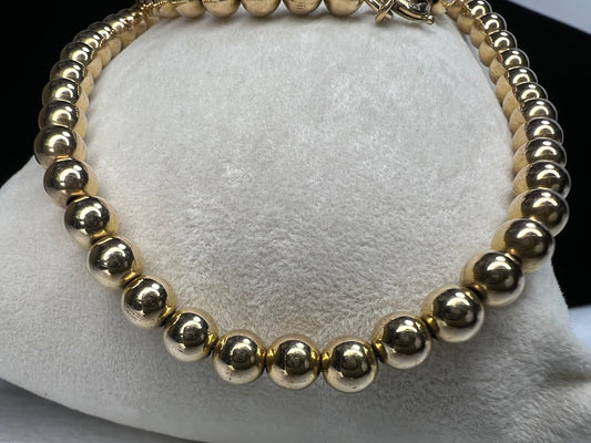 Enhance your outfit with this beautiful gold filled beaded necklace. It will add a touch of elegance and sophistication.