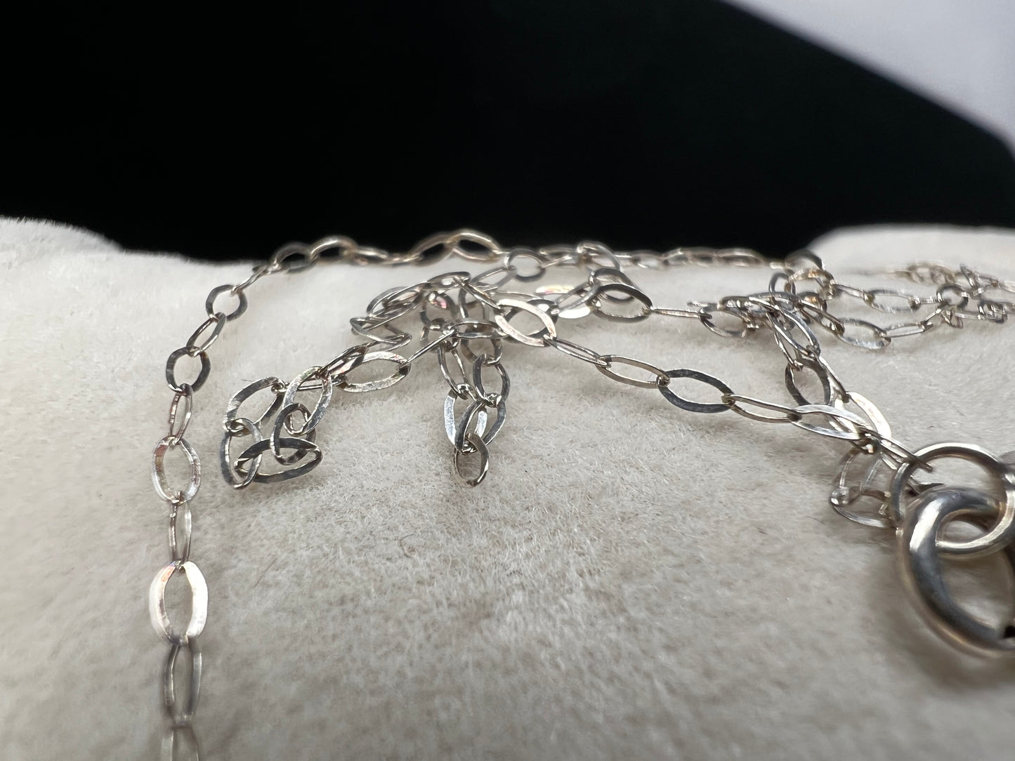 This petite sterling silver chain is sure to add a touch of elegance to your outfit. It is signed SVR.
