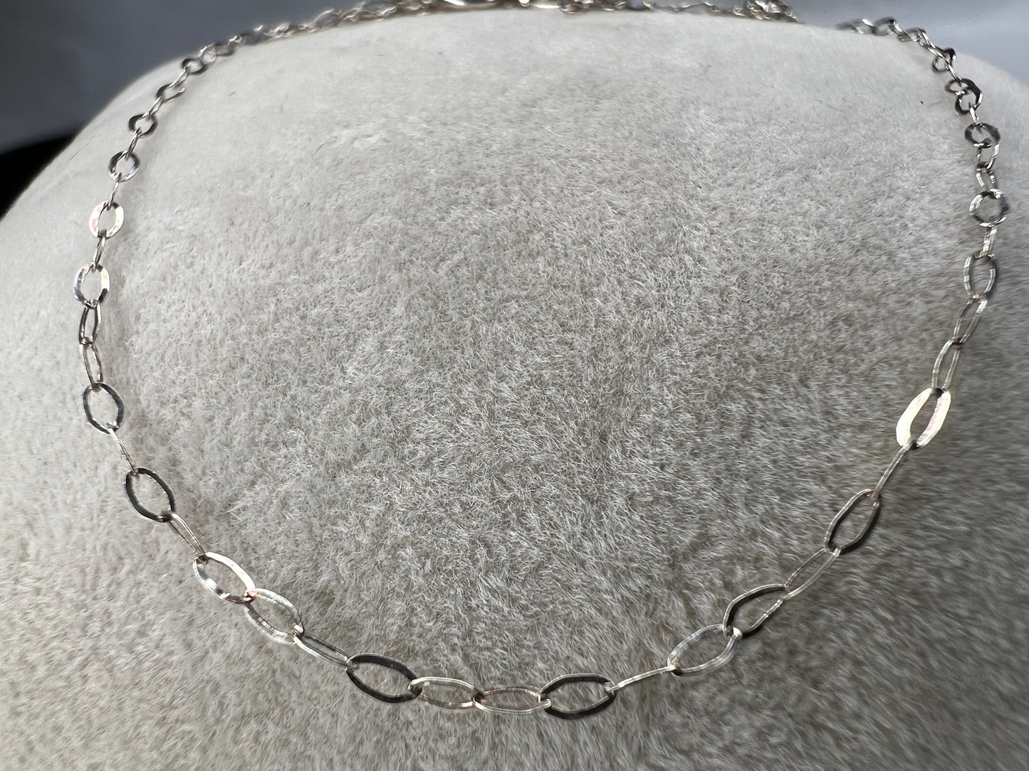 This petite sterling silver chain is sure to add a touch of elegance to your outfit. It is signed SVR.