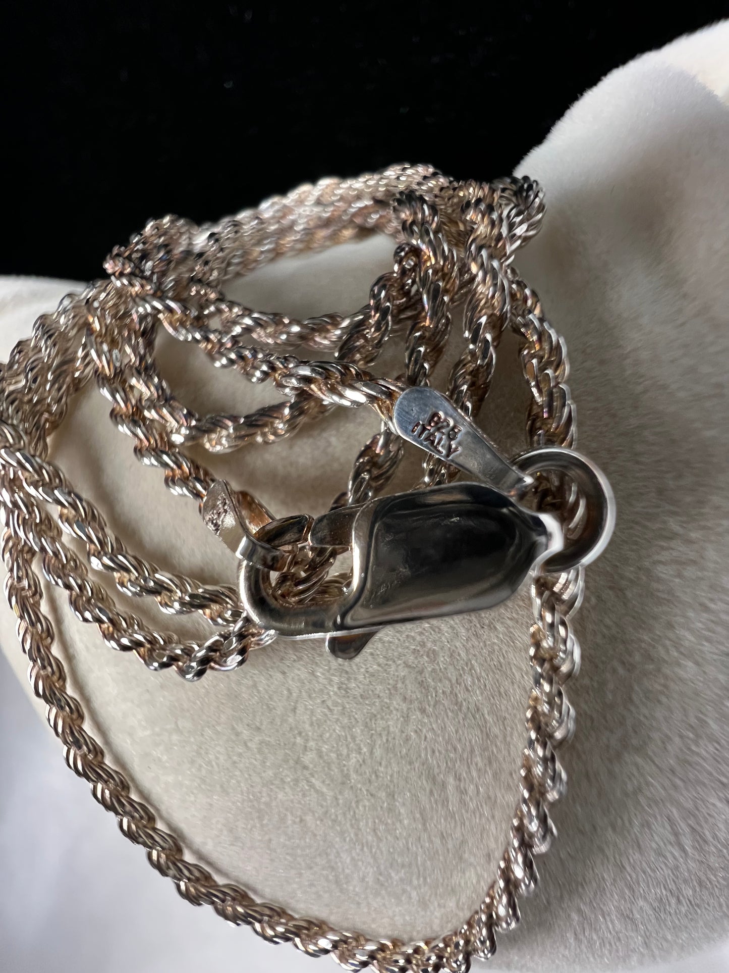 This long, thin sterling silver rope chain necklace exudes elegance and sophistication. Perfect for everyday wear or special occasions.