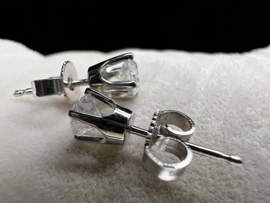 This is a unique pair of clear white galaxy diamonds set in 14 karat white gold. Galaxy diamonds have a celestial appearance due to numerous inclusions. These are natural, untreated diamonds.