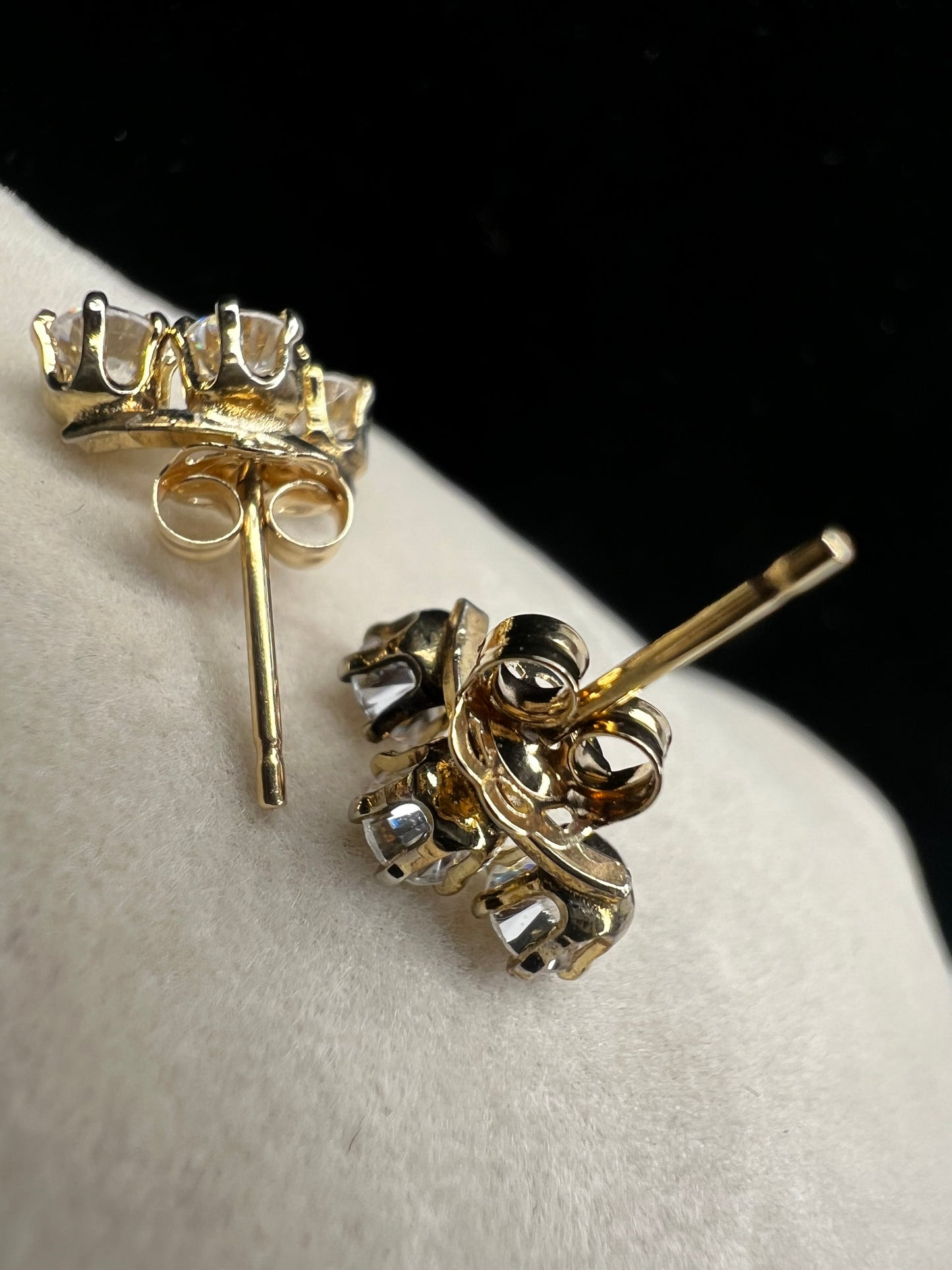 Add some sparkle to your outfit with this interesting pair of triple setting earrings. They feature cubic zirconia stones, so you get the look of diamonds without the higher cost.