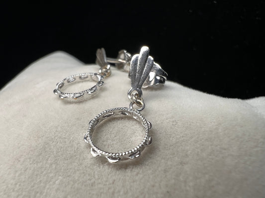 These earrings look like little tambourines. Crafted from 14 karat white gold, these would be perfect for any music lover.