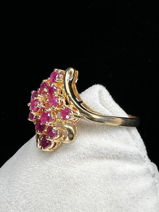 Crafted from 10 karat gold and a large cluster of rubies, this elegant cocktail ring will make an impression.
