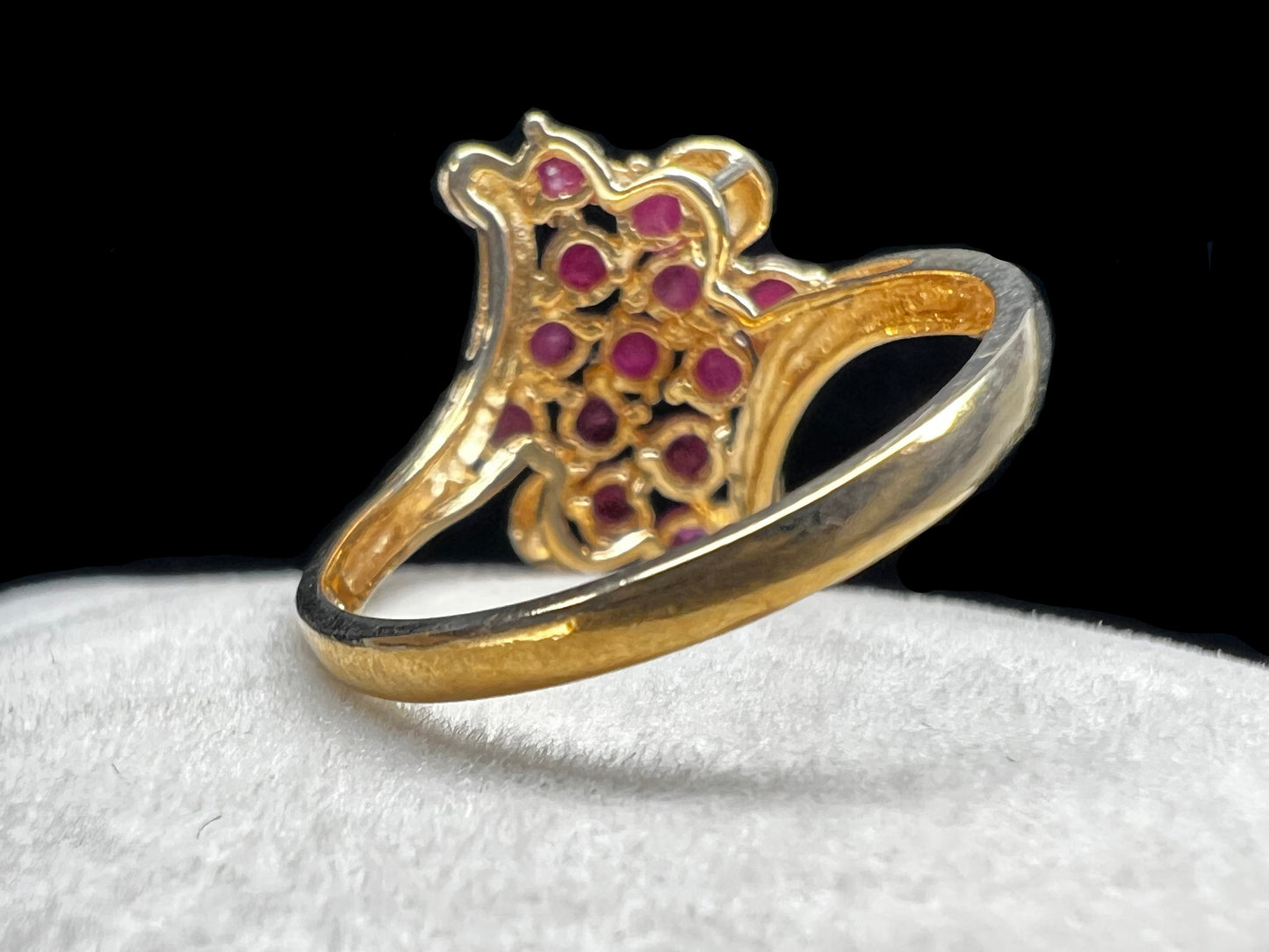 Crafted from 10 karat gold and a large cluster of rubies, this elegant cocktail ring will make an impression.