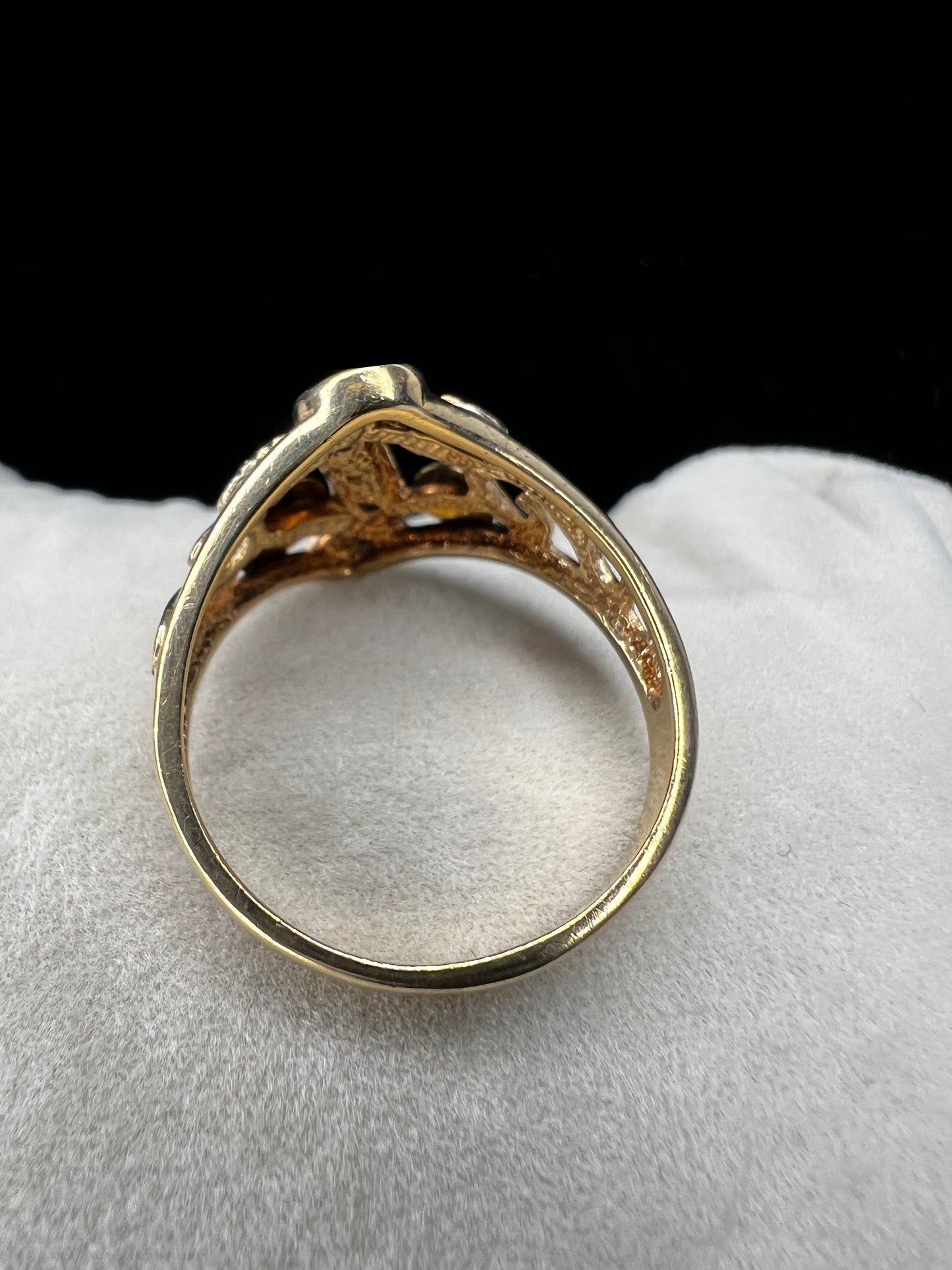 This ring features the signature look of Black Hills gold offered by Coleman Co. Made from 10 karat gold, it features a strip of small diamonds down the center.