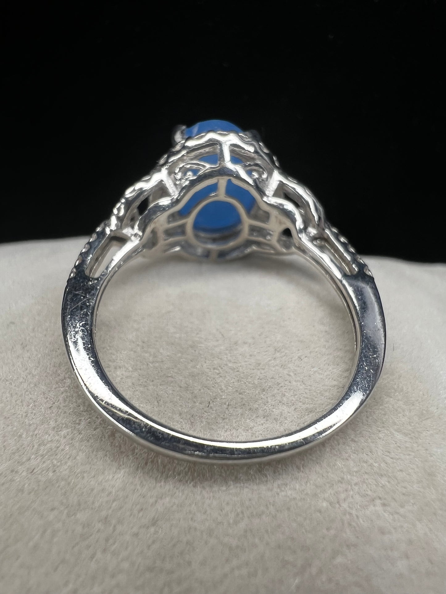 Elevate your style with this ring. Carefully crafted with a blue oval chalcedony in a well-made setting, this ring adds a touch of elegance to any outfit.