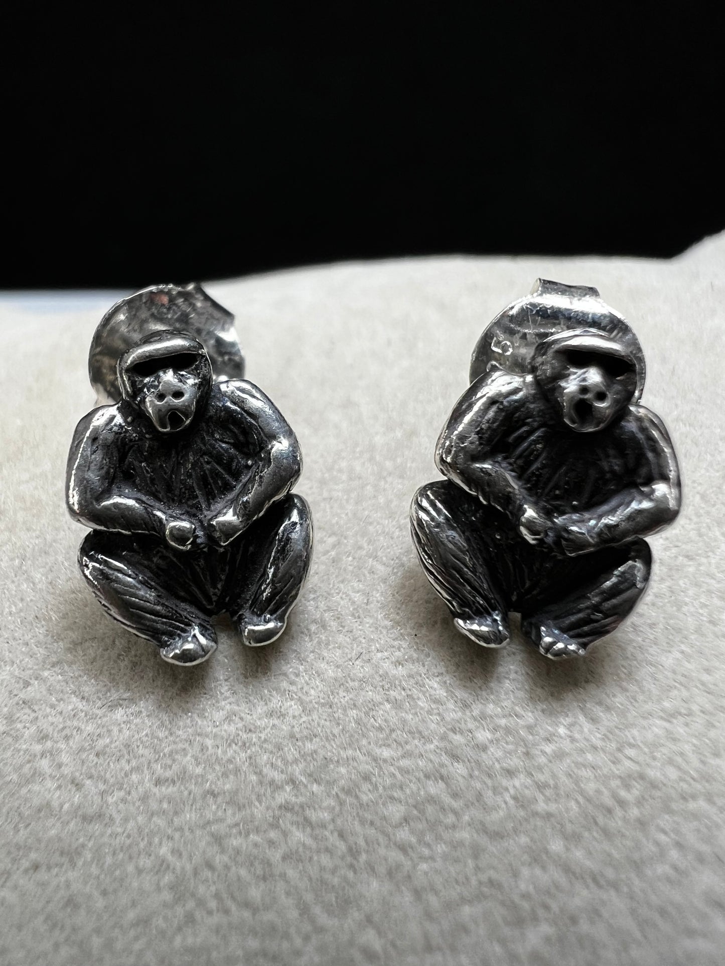 Crafted from sterling silver, these gorilla stud earrings combine playful charm with expert craftsmanship. Their compact size makes them perfect for everyday wear, adding a subtle yet distinctive touch to any outfit.