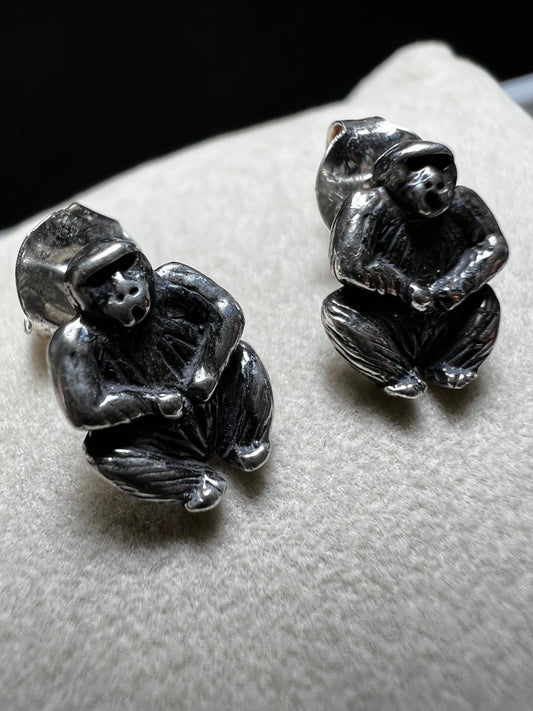 Crafted from sterling silver, these gorilla stud earrings combine playful charm with expert craftsmanship. Their compact size makes them perfect for everyday wear, adding a subtle yet distinctive touch to any outfit.