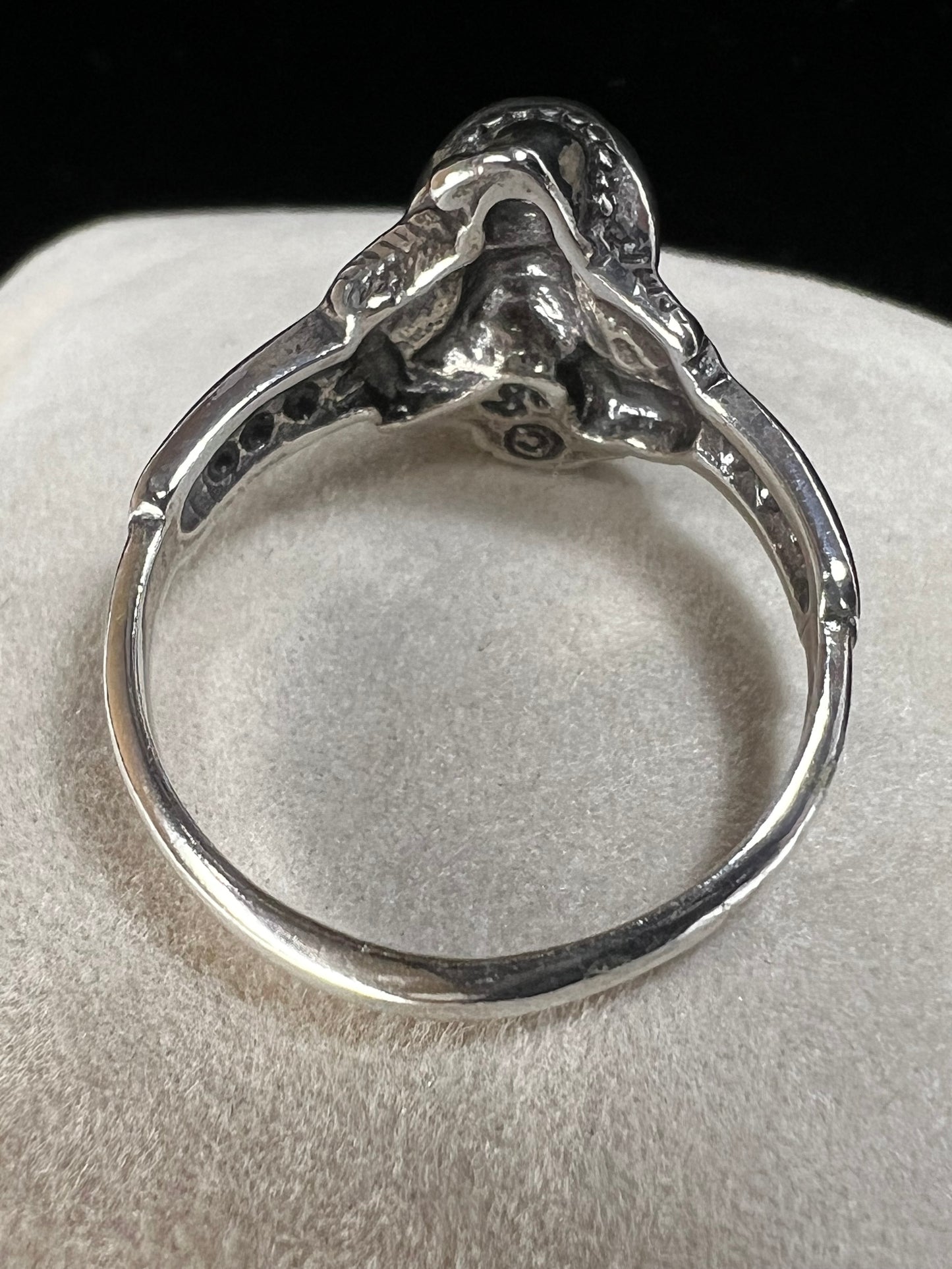 Add some magical mystique to your day with this sterling silver ring. It features a wizard and his crystal ball, which flashes multiple colors when moved in the light. This piece is marked with a copyright symbol and an S with a line through it (a dollar sign of sorts).