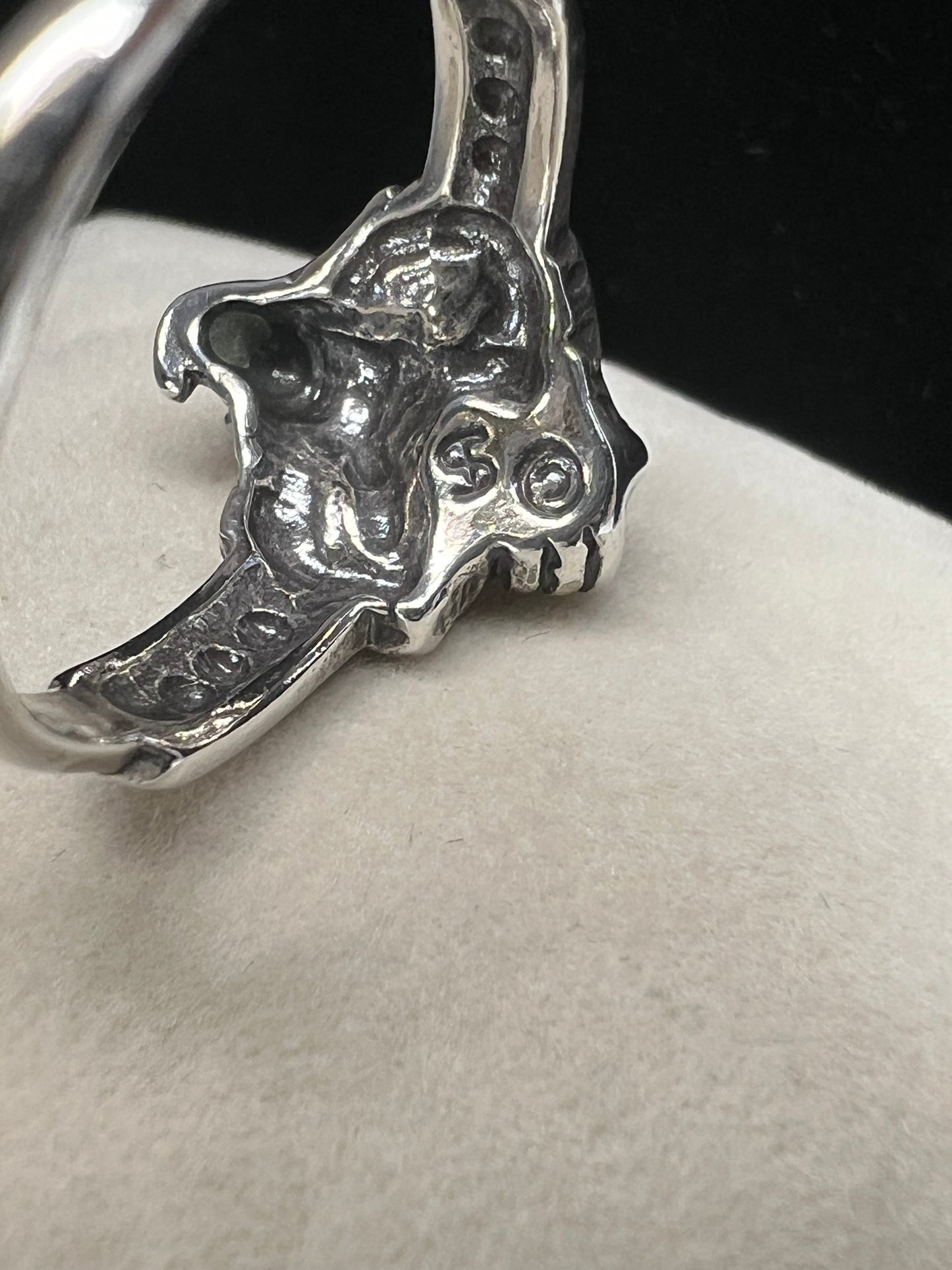 Add some magical mystique to your day with this sterling silver ring. It features a wizard and his crystal ball, which flashes multiple colors when moved in the light. This piece is marked with a copyright symbol and an S with a line through it (a dollar sign of sorts).