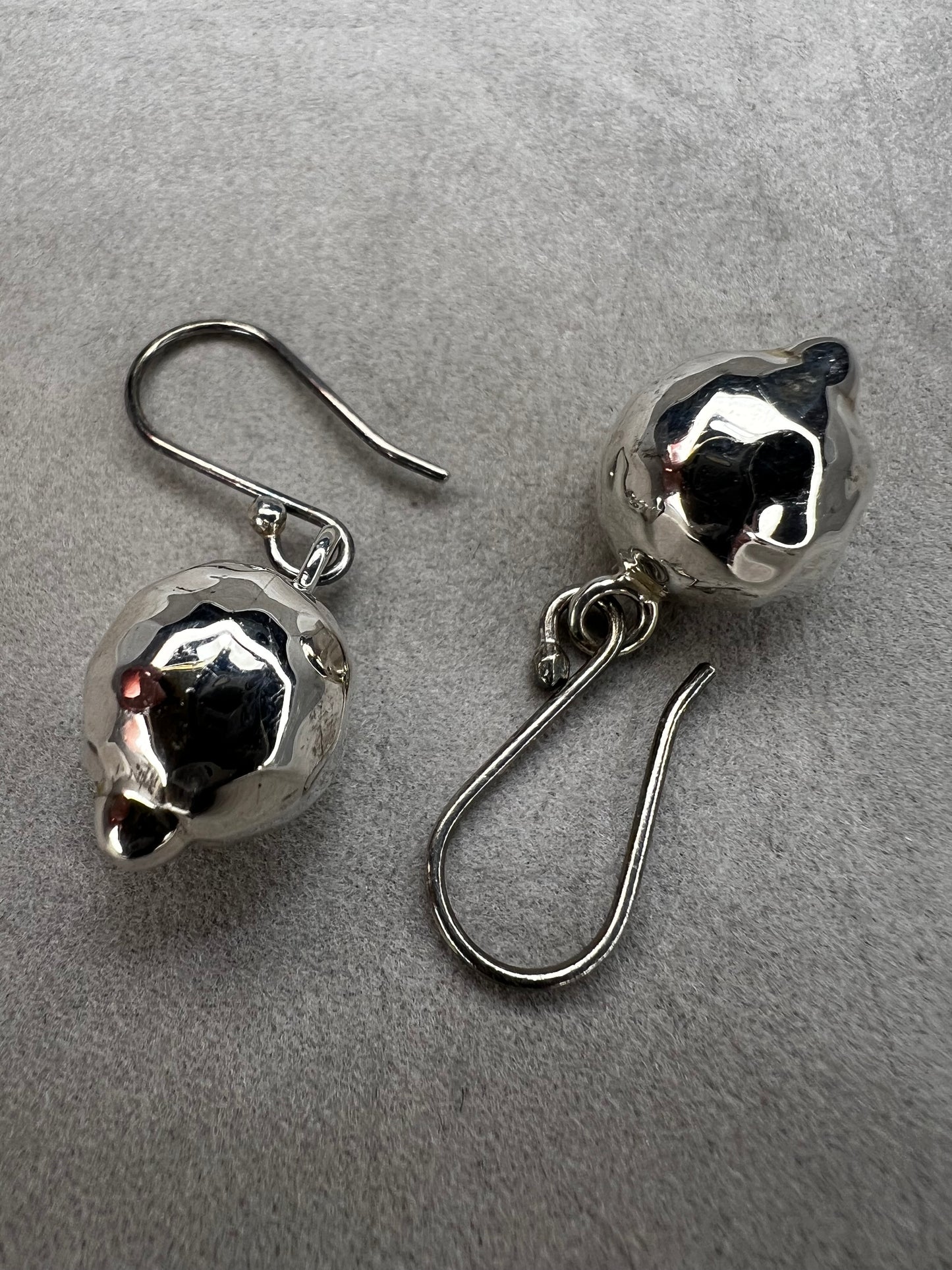 These sterling silver earrings are designed to add movement and shimmer to any outfit.