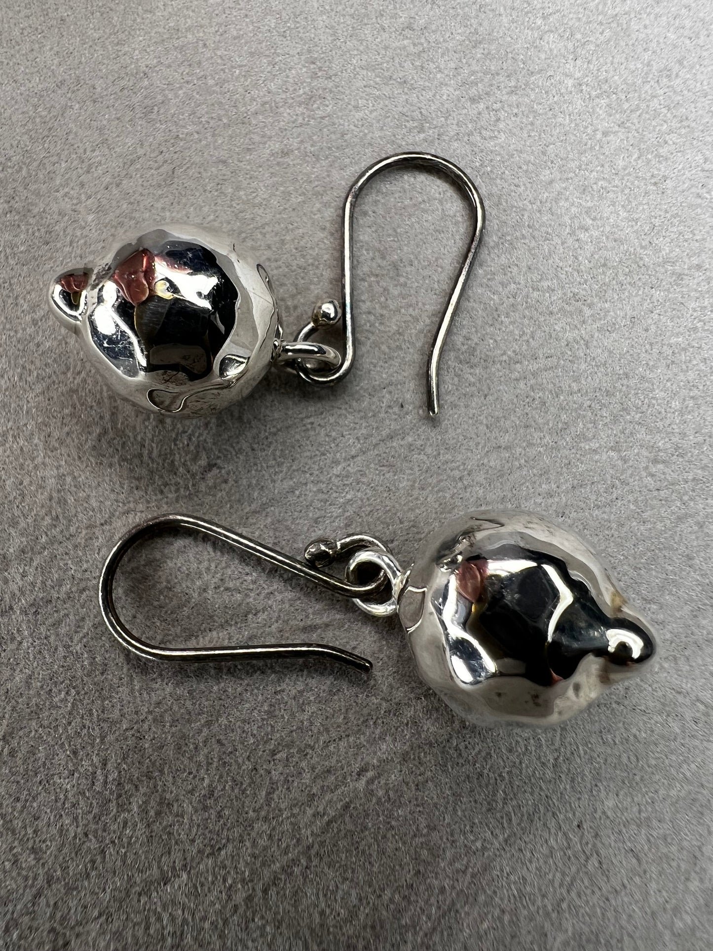 These sterling silver earrings are designed to add movement and shimmer to any outfit.