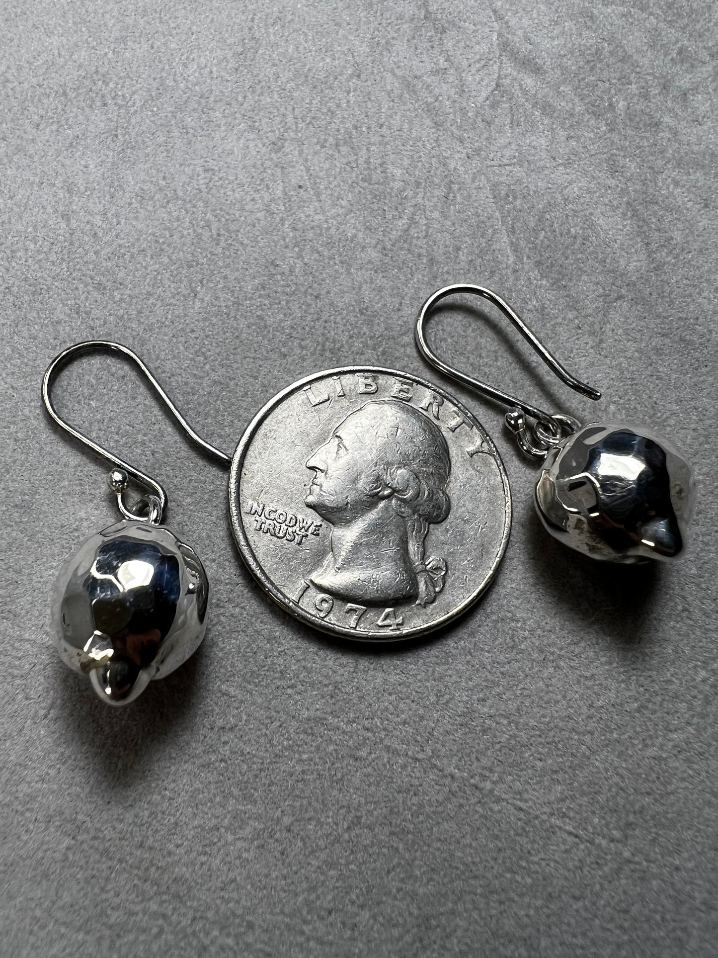 These sterling silver earrings are designed to add movement and shimmer to any outfit.