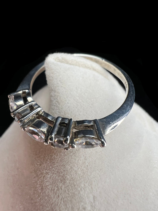 This sterling silver ring showcases both marquise cut and round cut cubic zirconia stones. This piece gives you the sparkle of diamonds without the higher price.