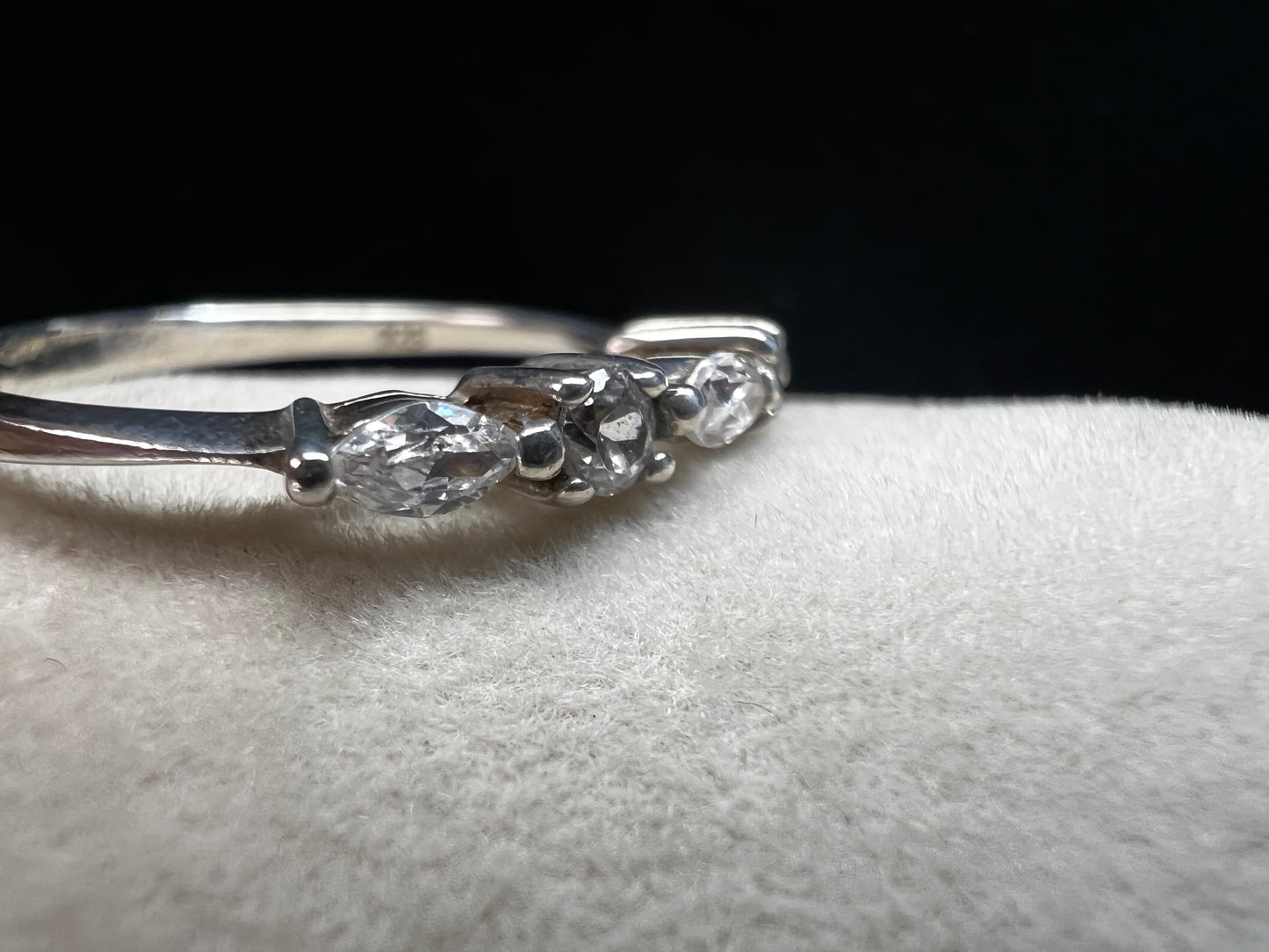 This sterling silver ring showcases both marquise cut and round cut cubic zirconia stones. This piece gives you the sparkle of diamonds without the higher price.