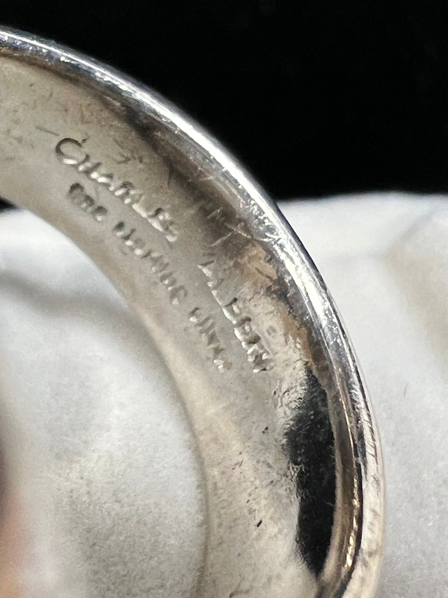 This is a large amethyst specimen ring, made with sterling silver, from designer Charles Albert. Please note that the specimen does have fractures but is priced accordingly -- and this piece deserves to continue on its journey with someone new.