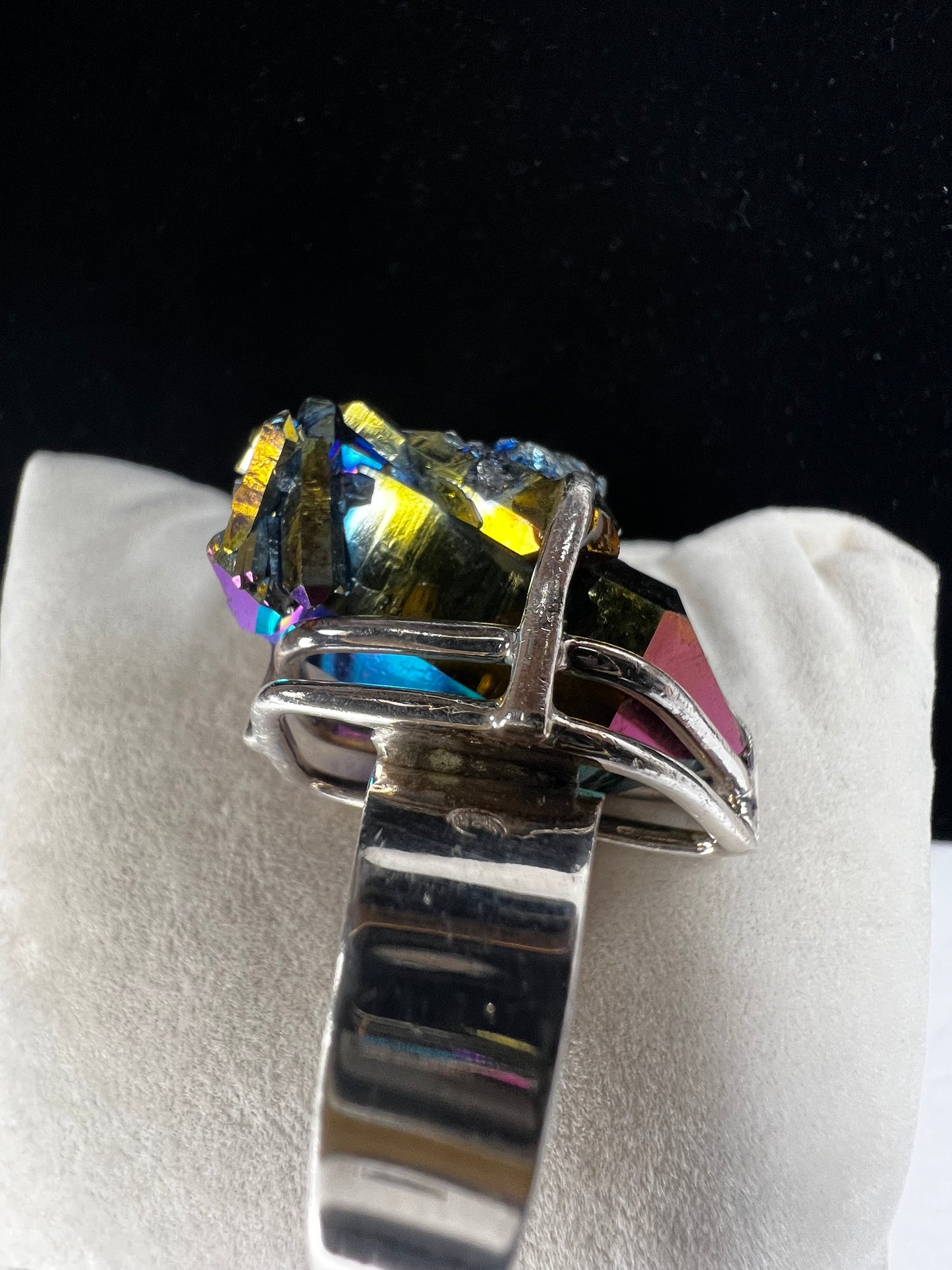 This is an amazing ring with a large titanium specimen expertly set in sterling silver.