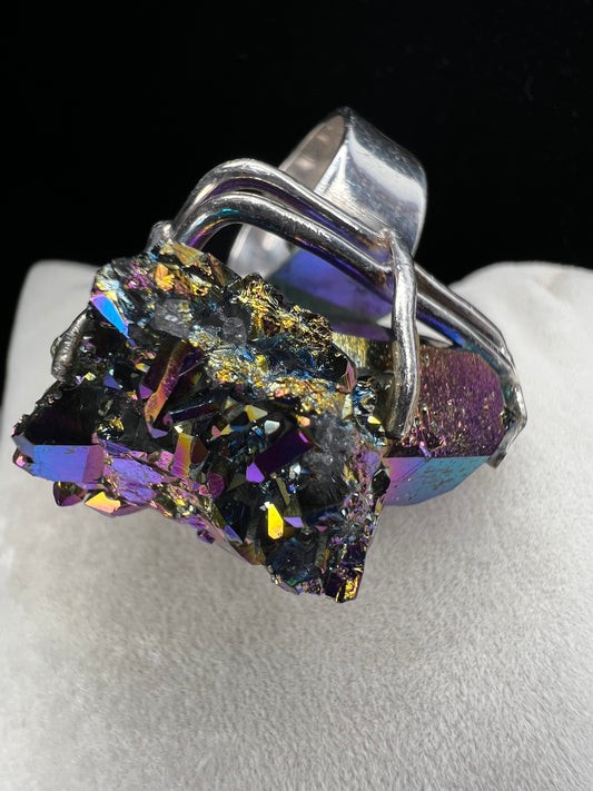 This is an amazing ring with a large titanium specimen expertly set in sterling silver.