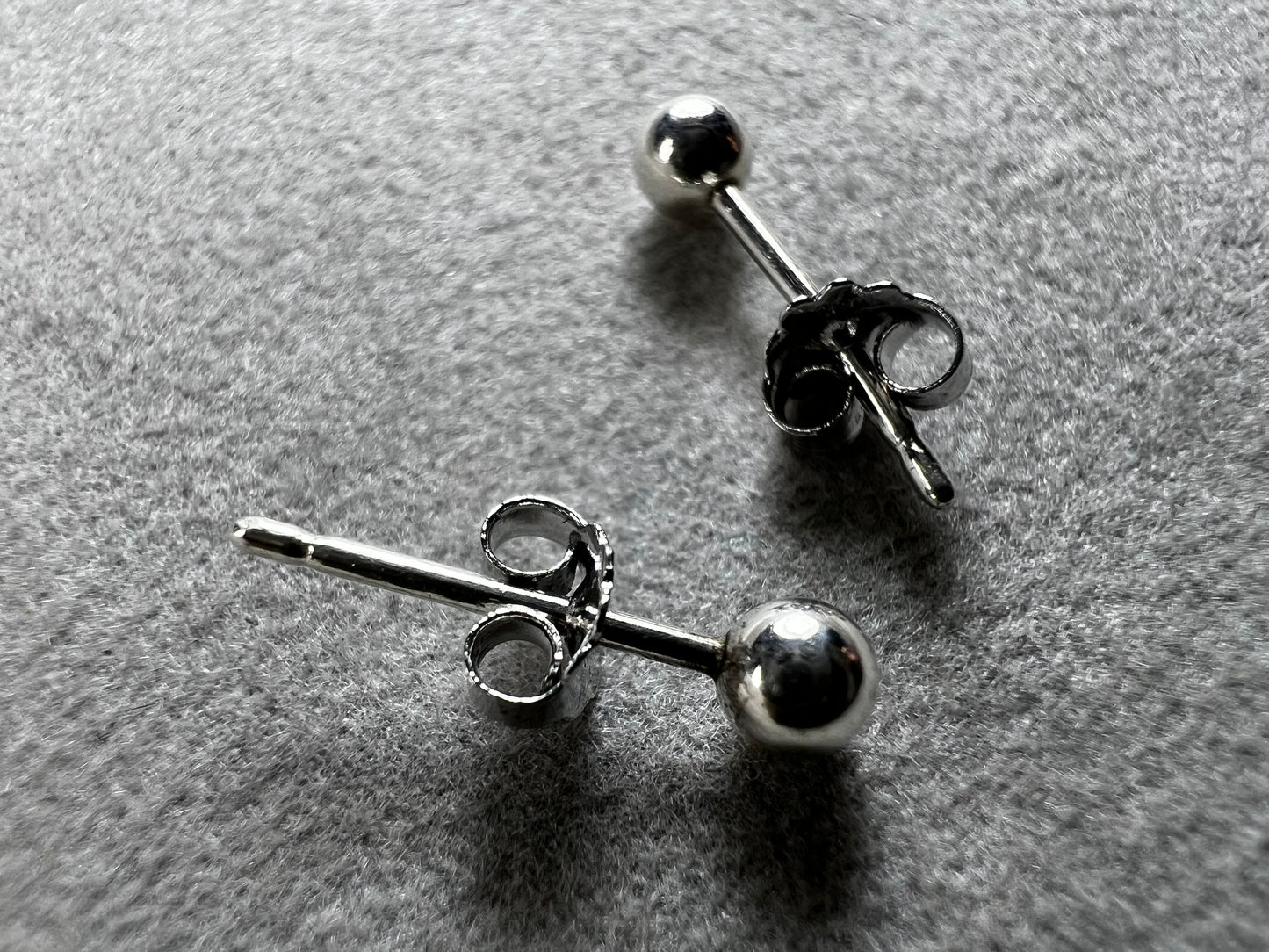 These sterling silver petite ball stud earrings bring a playful sparkle to your look. They’re perfect for everyday wear or adding a subtle shine to any outfit.