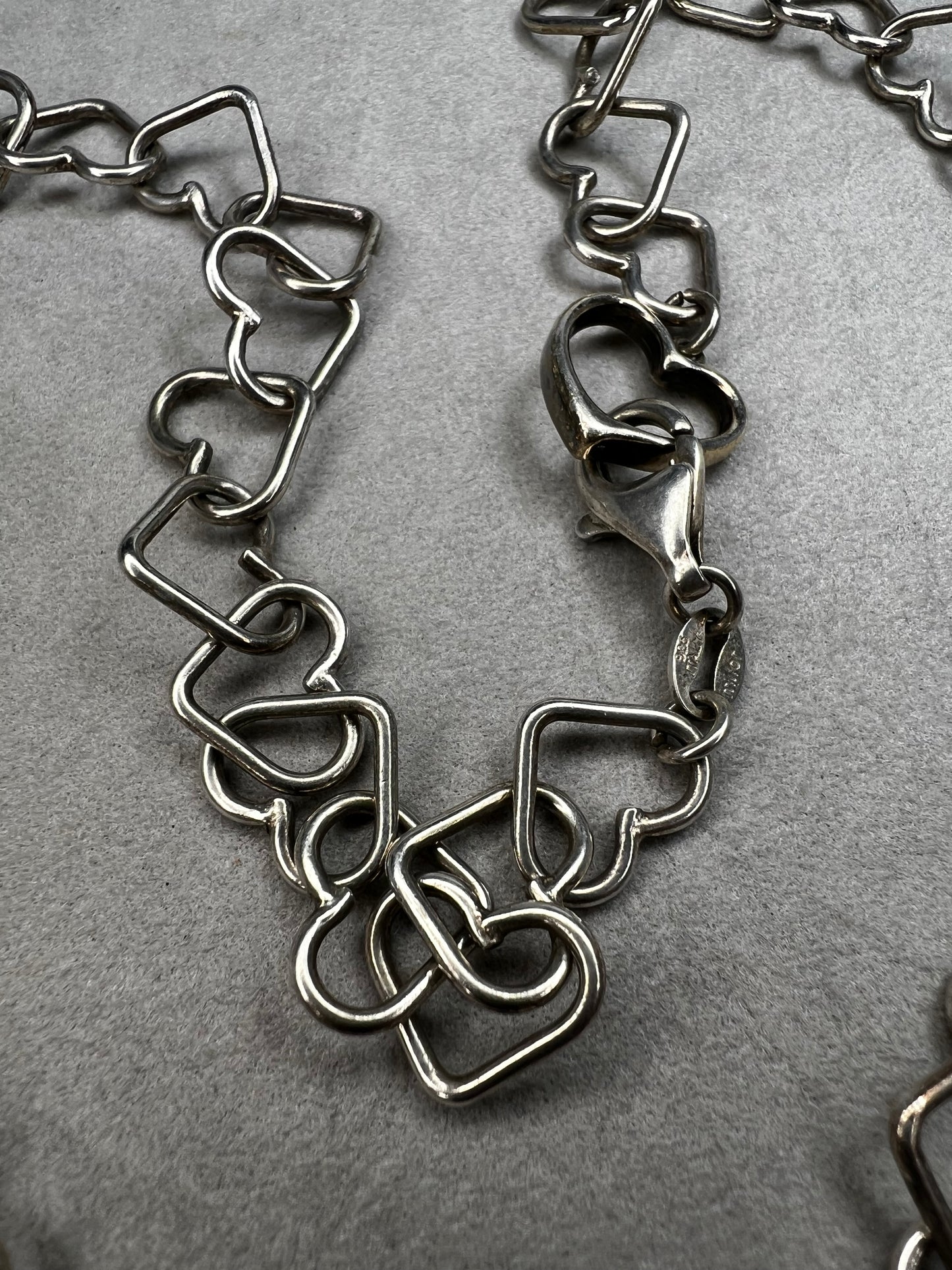 This 18" sterling silver necklace by Milor Italy showcases distinctive heart-shaped links, blending craftsmanship with elegant design. The unique link pattern is perfect for expressing personal style.