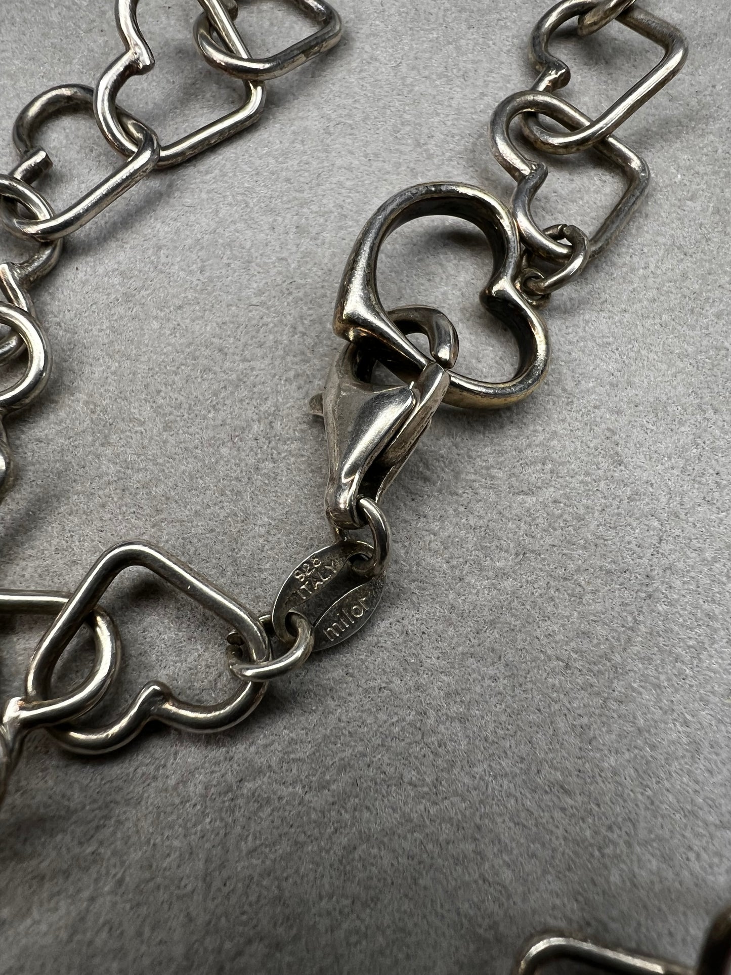 This 18" sterling silver necklace by Milor Italy showcases distinctive heart-shaped links, blending craftsmanship with elegant design. The unique link pattern is perfect for expressing personal style.
