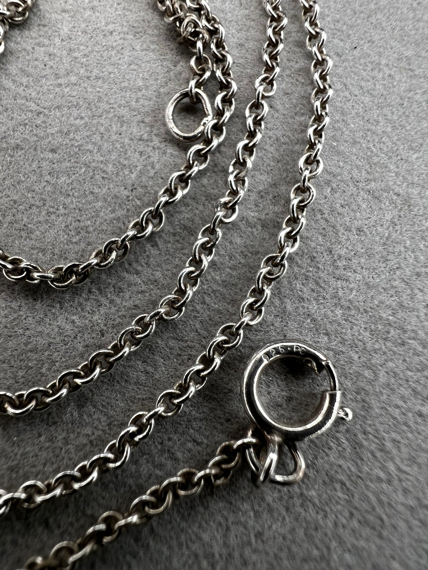 This sterling silver chain features a petite link. It is ready to be paired with a small pendant -- or wear it on its own for a touch of class.