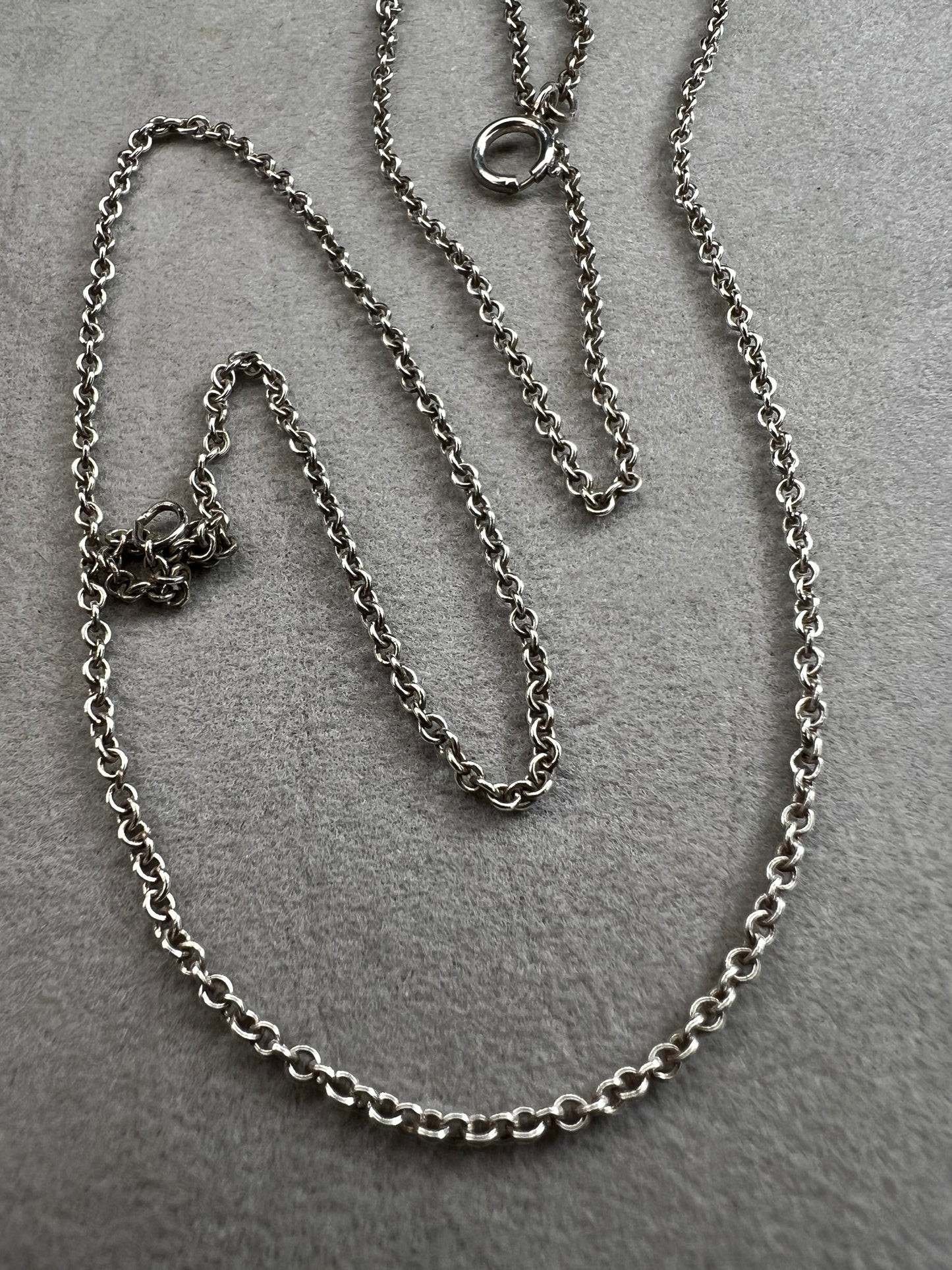 This sterling silver chain features a petite link. It is ready to be paired with a small pendant -- or wear it on its own for a touch of class.