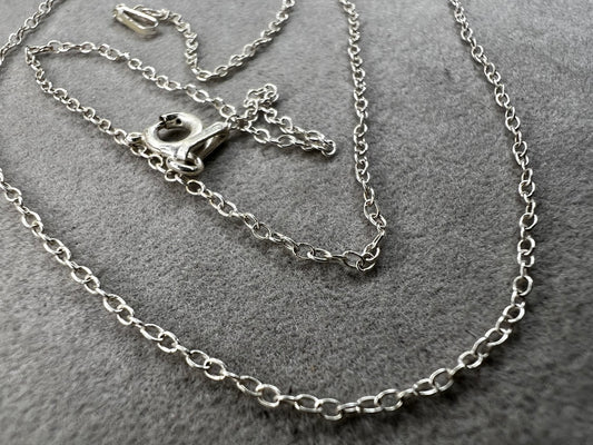 This petite sterling silver chain features a classic cable link, making it a versatile piece for your collection. It works on its own or layered with other necklaces -- or pair it with one of our small pendants.