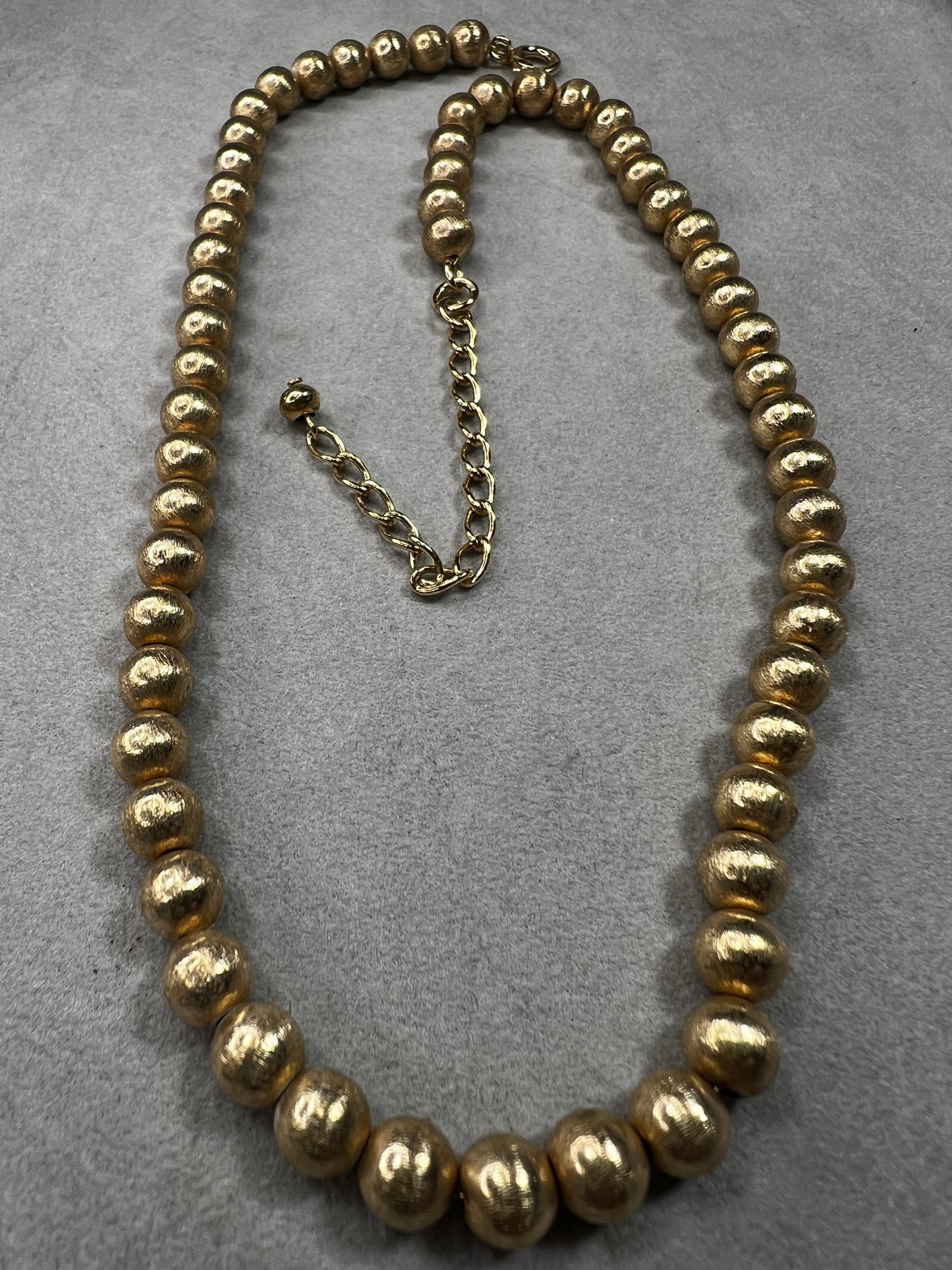 This 16" necklace features a gold-filled chain accented with gold-filled beads, designed to catch the light beautifully with every movement. It offers a refined yet versatile addition to elevate any wardrobe.