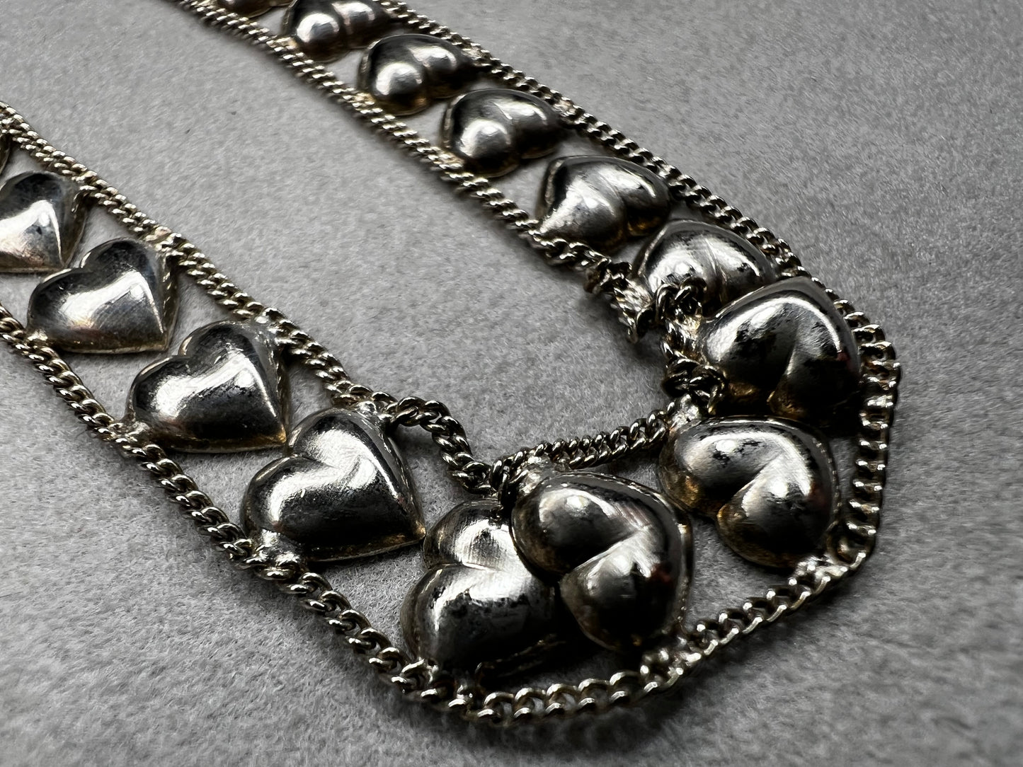This vintage sterling silver chain and heart bracelet combines timeless durability with elegant design. Crafted from high-quality sterling silver, it offers a lasting piece that carries sentimental value.
