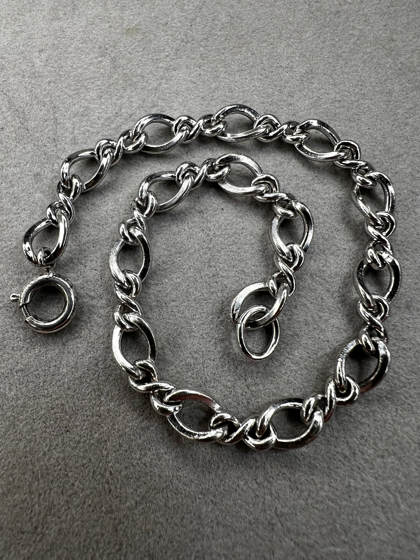 This classic sterling silver bracelet serves as the perfect foundation for personal expression, ready to be paired with a variety of charms.