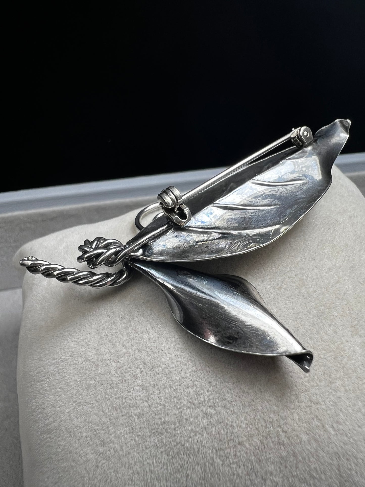 This sterling silver brooch features detailed craftsmanship that captures the beauty of nature -- perfect for anyone who loves the outdoors.