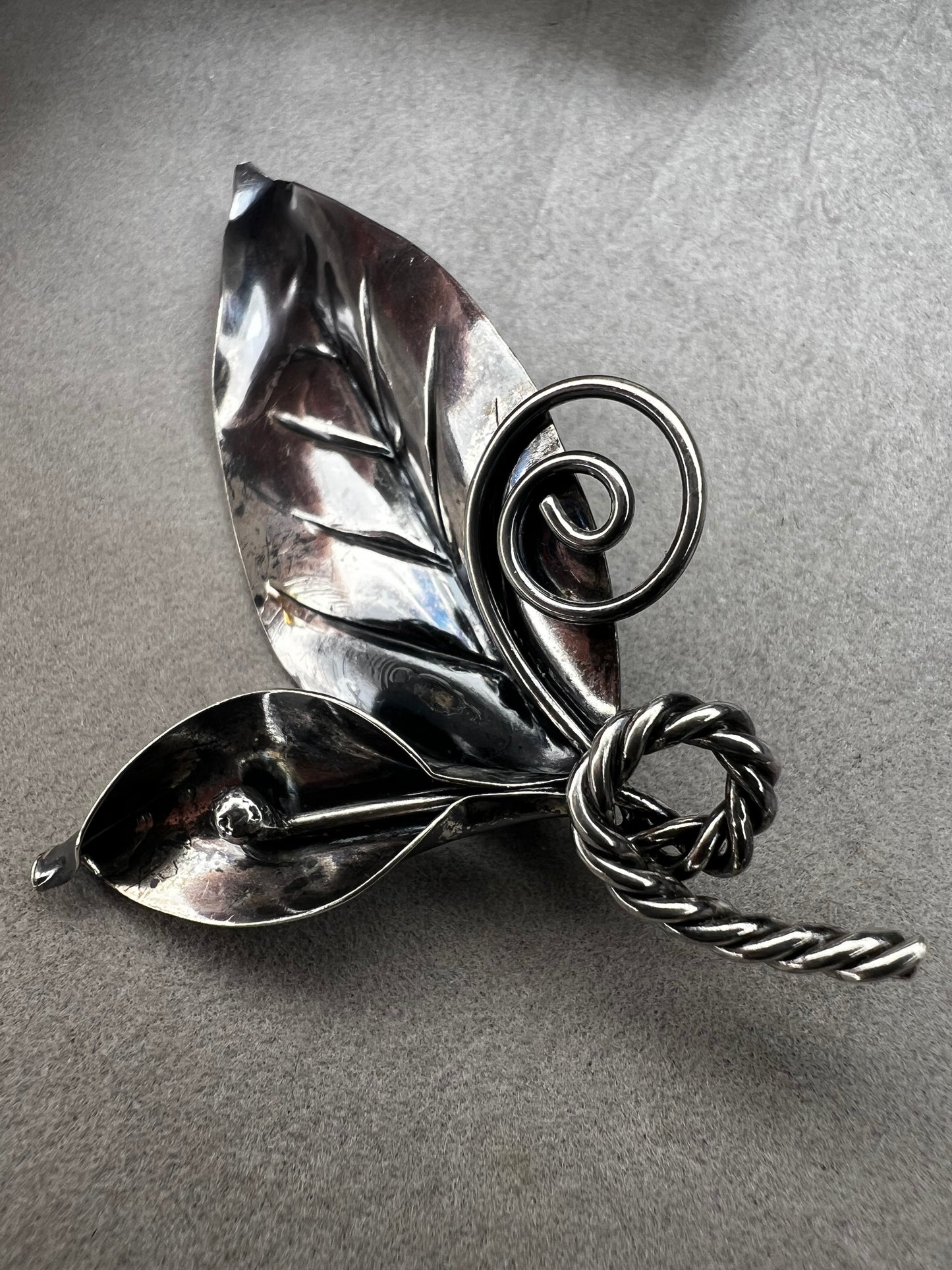 This sterling silver brooch features detailed craftsmanship that captures the beauty of nature -- perfect for anyone who loves the outdoors.