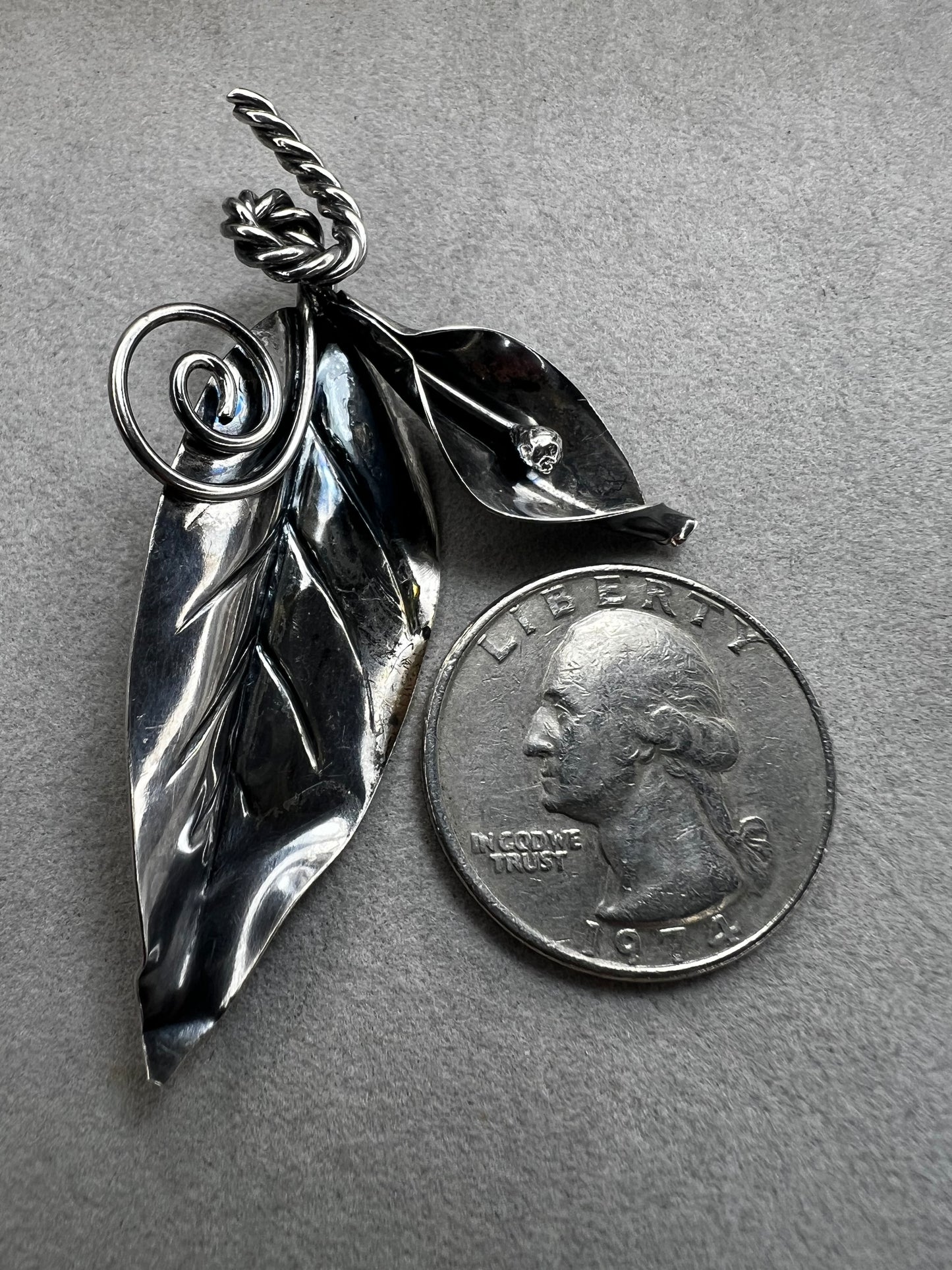 This sterling silver brooch features detailed craftsmanship that captures the beauty of nature -- perfect for anyone who loves the outdoors.
