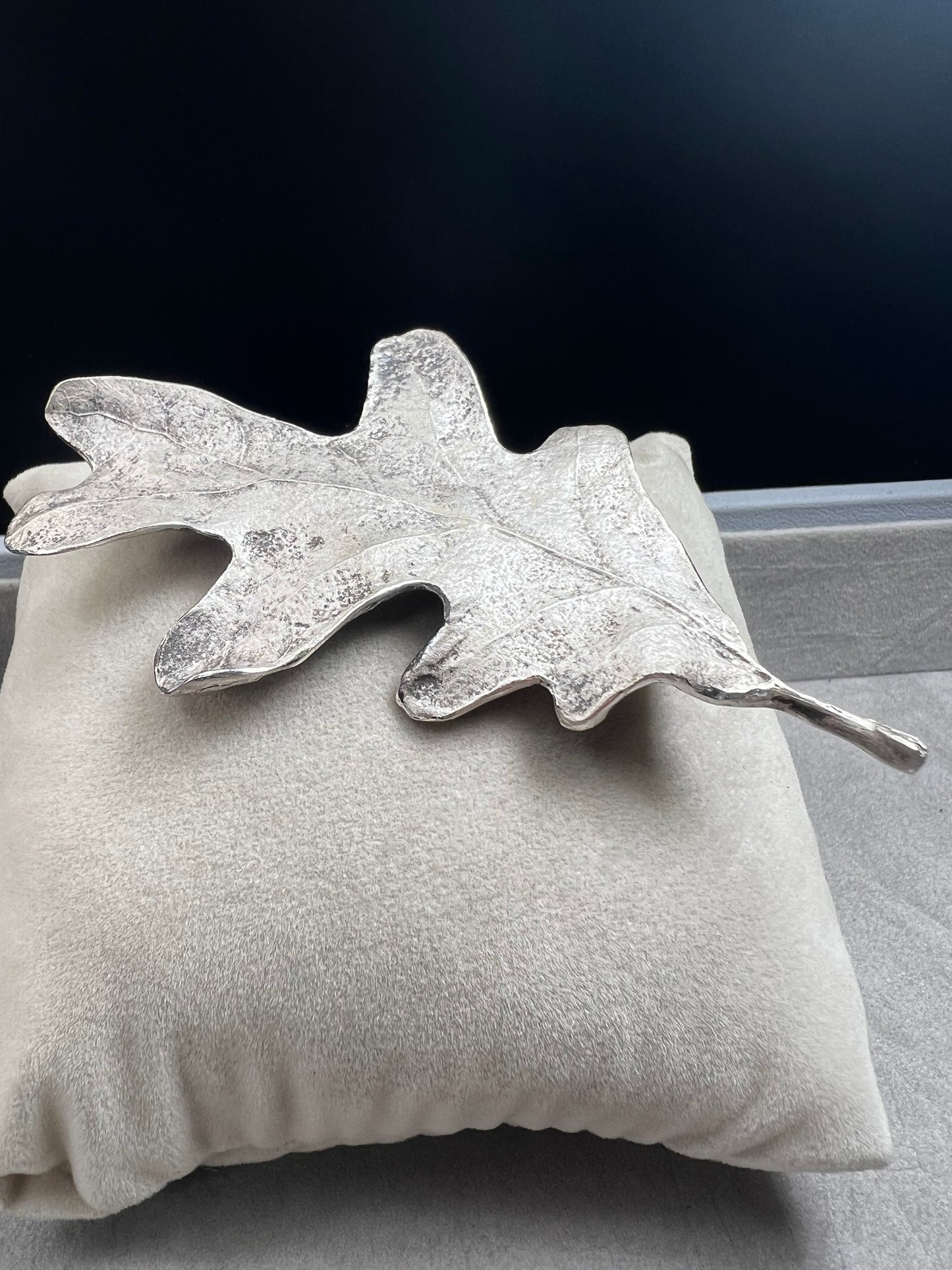 Shaped like an oak leaf, this sterling silver brooch captures nature’s beauty in exquisite detail. Its realistic design makes it a standout piece wherever it’s worn.